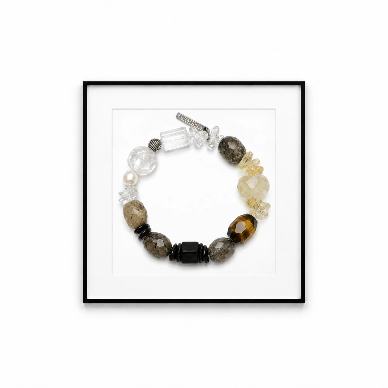Crystal bracelet displayed in a black gallery frame